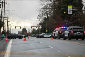 Police block off Casino Road during a standoff following a shooting at the Bluffs at Evergreen apartment complex Monday, Jan. 22, 2024, in Everett, Washington. (Ryan Berry / The Herald)