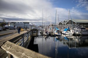 People walk along the Port of Edmonds on Sunday, Jan. 28, 2024 in Edmonds, Washington. (Annie Barker / The Herald)