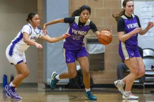 Lake Stevens’ Noelani Tupua steals the ball during the game against Kamiak on Wednesday, Jan. 3, 2024 in Mukilteo, Washington. (Olivia Vanni / The Herald)