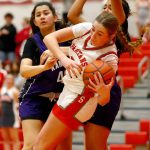 Stanwoods Ellalee Wortham spins out of trouble with the ball against Kamiak on Thursday, Nov. 30, 2023, at Stanwood High School in Stanwood, Washington. (Ryan Berry / The Herald)
