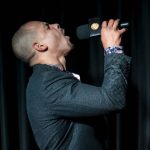 Washington Wolfpack head coach JR Wells howls during the Everett AFL team unveiling at Tony V's Garage in Everett, Washington onThursday, Oct. 26, 2023. (Annie Barker / The Herald)