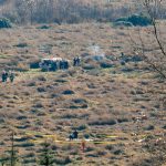 Emergency responders surround the wreckage of an airplane that crashed into a field along U.S. 2 just east of Snohomish on Friday, Nov. 18, 2022, in Snohomish, Washington. (Ryan Berry / The Herald)