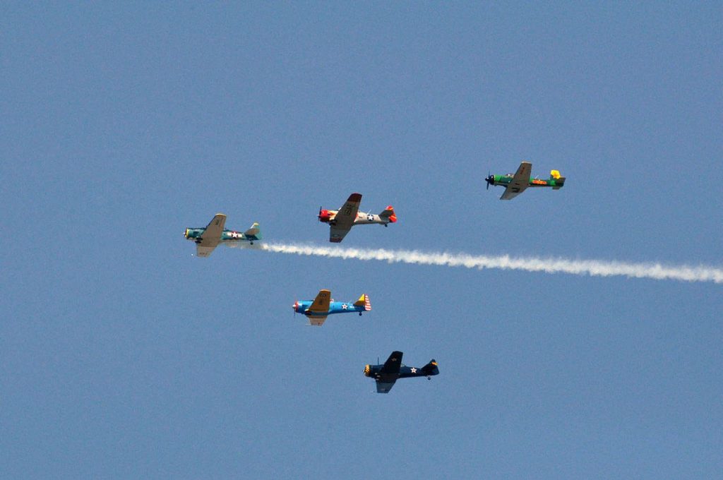 The Cascade Warbirds fly over Naval Station Everett. (Sue Misao / The Herald file)