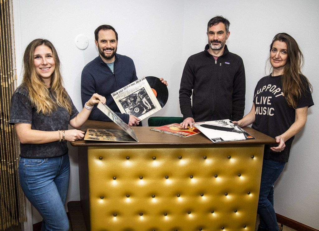 Elizabeth Murray, left, Jason Murray, Brian Gardner and Rachel Gardner at Musicology Co. on Thursday, Jan. 18, 2024 in Edmonds, Washington. (Olivia Vanni / The Herald)