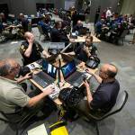 Law enforcement officers, firefighters and medics from Snohomish, King and Pierce counties use computers to simulate an active shooter scenario in a ballroom at Angel of the Winds Arena on Wednesday, June 13, 2018 in Everett, Wa. (Andy Bronson / The Herald)
