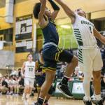 Marysville Getchells Ano Palacol, left, attempts to block a shot against Shorecrest during the game on Dec. 16, 2022, in Marysville. (Olivia Vanni / The Herald)
