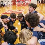 Toby Trichler, right, yells during a team cheer before the start of the game on Jan. 23 in Shoreline. (Olivia Vanni / The Herald)