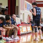 Eli Trichler, right, talks to his teammates on the bench during the game against Kings on Jan. 23 in Shoreline. (Olivia Vanni / The Herald)