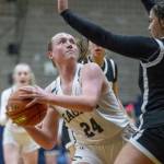 Arlingtons Katie Snow looks for an opening to shoot during a game Dec. 11, 2023 in Arlington. (Olivia Vanni / The Herald)