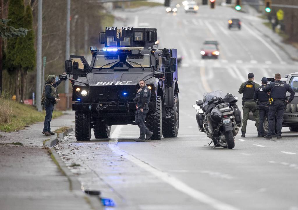 A SWAT vehicle drives along 112th Street SW on Wednesday, Jan. 31, 2024 in Everett, Washington. (Olivia Vanni / The Herald)
