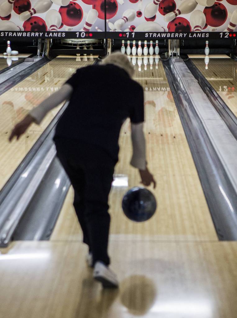 Carol Perry lines up her ball during league bowling at Strawberry Lanes on Wednesday, Feb. 26, 2020 in Marysville , Wa. (Olivia Vanni / The Herald)
