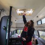 Johnson De Vor opens a ventilation latch at the top of the van on Monday, Feb. 5, 2024 in Granite Falls, Washington. (Olivia Vanni / The Herald)