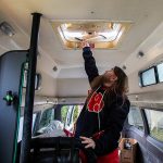 Johnson De Vor opens a ventilation latch at the top of the van on Monday, Feb. 5, 2024 in Granite Falls, Washington. (Olivia Vanni / The Herald)