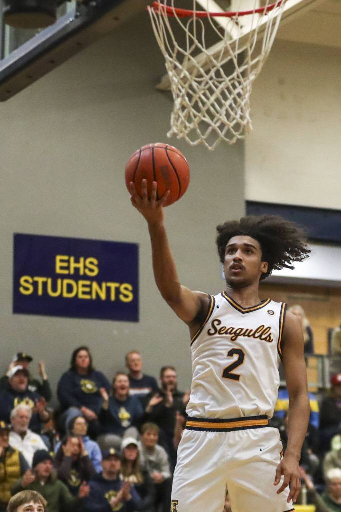 Everetts Isaiah White rises up for a layup during a game against Arlington at Everett High School on Jan. 26 in Everett. (Annie Barker / The Herald)