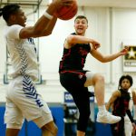 Everett Community Colleges Ethan Martin looks on as Edmonds Colleges Solomon Barnes comes up with the ball on Wednesday, Feb. 7, 2024, at Seaview Gym in Lynnwood, Washington. (Ryan Berry / The Herald)