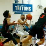 Edmonds Colleges Chris Lee head fakes a shot against Everett Community College on Wednesday, Feb. 7, 2024, at Seaview Gym in Lynnwood, Washington. (Ryan Berry / The Herald)