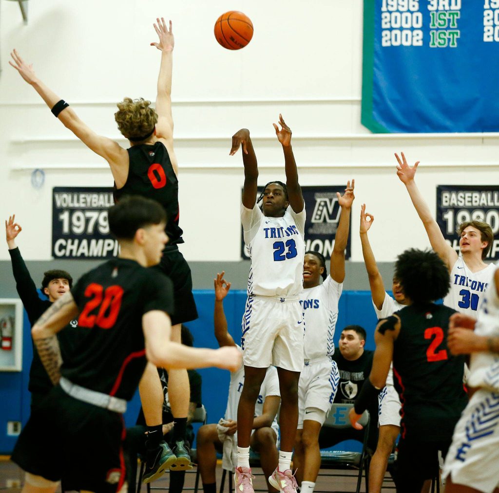 Edmonds Colleges Josiah Pierre puts up a three against Everett Community College on Wednesday, Feb. 7, 2024, at Seaview Gym in Lynnwood, Washington. (Ryan Berry / The Herald)