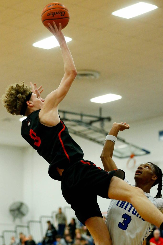 Everett Community Colleges Hayden Conaxis takes an off-balance shot against Edmonds College on Wednesday, Feb. 7, 2024, at Seaview Gym in Lynnwood, Washington. (Ryan Berry / The Herald)