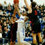Edmonds Colleges Chris Lee scores in traffic against Everett Community College on Wednesday, Feb. 7, 2024, at Seaview Gym in Lynnwood, Washington. (Ryan Berry / The Herald)