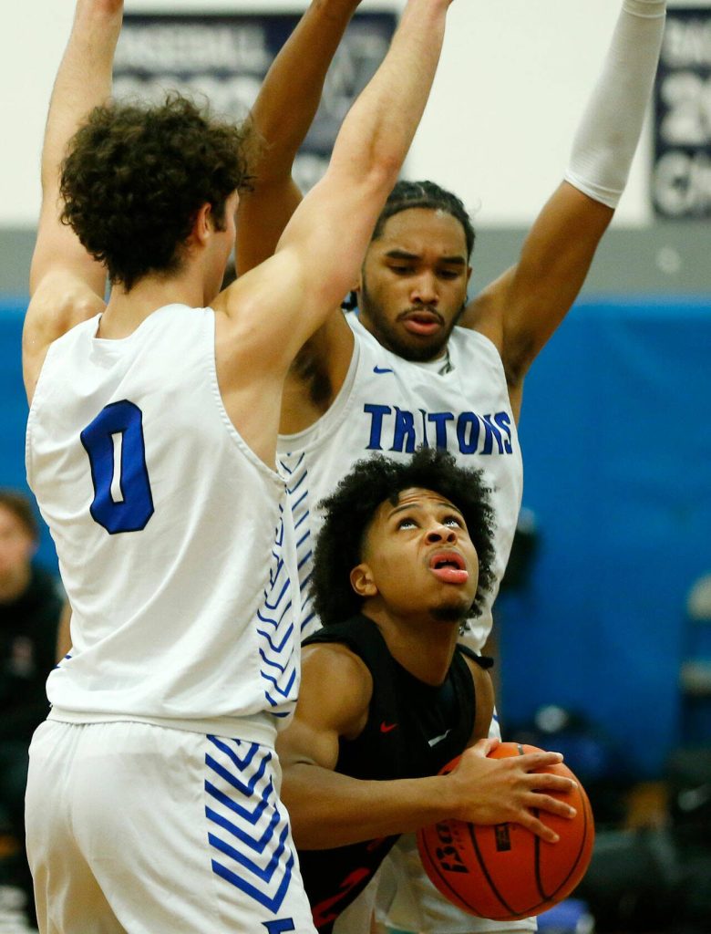 Everett Community Colleges Jailin Johnson looks up while losing space to shoot against Edmonds College on Wednesday, Feb. 7, 2024, at Seaview Gym in Lynnwood, Washington. (Ryan Berry / The Herald)