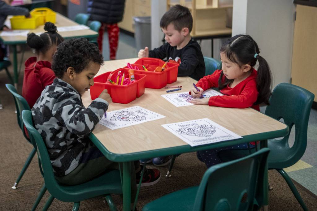 Students color in Leeanne Bennetts transitional kindergarten class at Jefferson Elementary on Wednesday, Feb. 14, 2024 in Everett, Washington. (Annie Barker / The Herald)