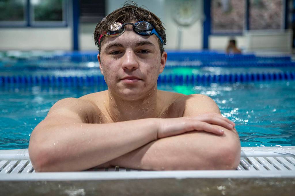Jackson High School swimmer Ethan Georgiev poses for a photo on Wednesday, Feb. 7, 2024 at West Coast Aquatics in Bothell, Washington. (Annie Barker / The Herald)