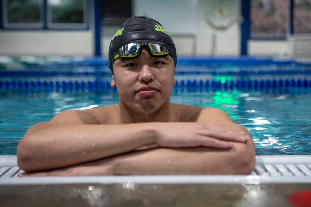 Jackson High School swimmer Vyron Domingo poses for a photo on Wednesday, Feb. 7, 2024 at West Coast Aquatics in Bothell, Washington. (Annie Barker / The Herald)