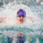 Lake Stevens junior Camden Blevins-Mohr swims in the 100-yard butterfly during the Class 4A District 1 swim and dive championships Saturday at the Snohomish Aquatic Center in Snohomish. (Ryan Berry / The Herald)