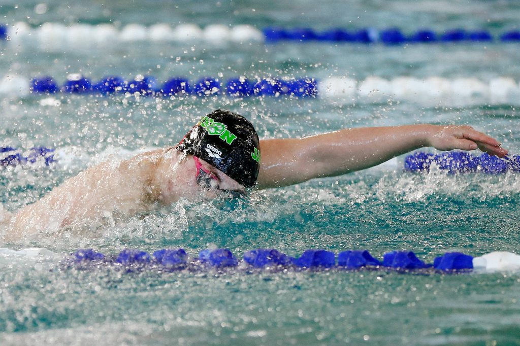 Jackson senior Ethan Georgiev swims in the 100-yard freestyle during the Class 4A District 1 swim and dive championships Saturday at the Snohomish Aquatic Center in Snohomish. (Ryan Berry / The Herald)