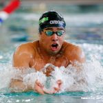 Jackson senior Ethan Chen-Parks takes the lead in the 100-yard breaststroke during the Class 4A District 1 swim and dive championships Saturday at the Snohomish Aquatic Center in Snohomish. (Ryan Berry / The Herald)