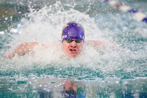 Lake Stevens junior Camden Blevins-Mohr swims in the 100 yard butterfly during the WESCO 4A Boys Swim and Dive meet Saturday, Feb. 10, 2024, at the Snohomish Aquatic Center in Snohomish, Washington. (Ryan Berry / The Herald)