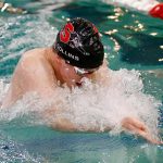 Snohomish junior Owen Collins swims to a victory in the 100 yard breaststroke during the Class 3A District 1 swim and dive meet Saturday at the Snohomish Aquatic Center in Snohomish. (Ryan Berry / The Herald)