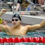 Shorecrest junior Tristan Serrano celebrates his victory in the 50 yard freestyle during the Class 3A District 1 swim and dive meet Saturday at the Snohomish Aquatic Center in Snohomish. (Ryan Berry / The Herald)