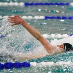 Cascades Yurii Onofriichuk swims in the 100 yard backstroke during the Class 3A District 1 swim and dive meet Saturday at the Snohomish Aquatic Center in Snohomish. (Ryan Berry / The Herald)
