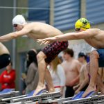Swimmers wait to dive for their lap in the 200 yard freestyle relay during the Class 3A District 1 swim and dive meet Saturday at the Snohomish Aquatic Center in Snohomish. (Ryan Berry / The Herald)