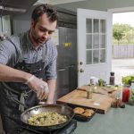 Chef Cody Castiglia of Della Terra, a catering company in Snohomish, prepares a dish of Black Cod Acqua Pazza. (Kevin Clark / The Herald)