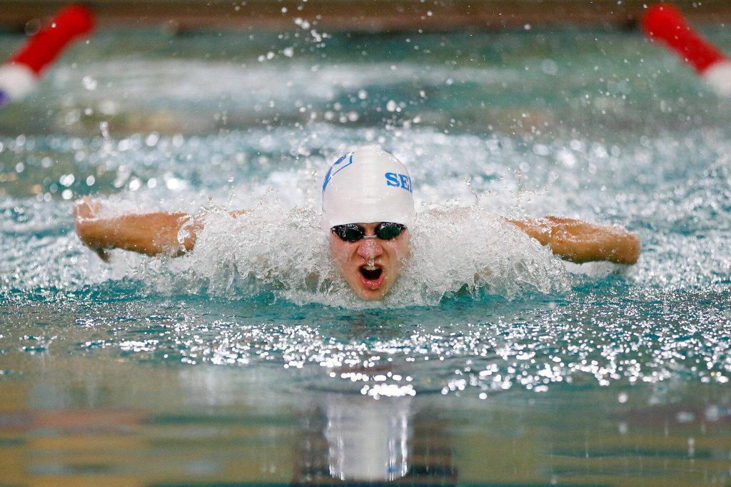 Shorewoods Larson Buchholz swims in the 100-yard butterfly during the 3A District 1 championship meet Feb. 10 at the Snohomish Aquatic Center in Snohomish. (Ryan Berry / The Herald)