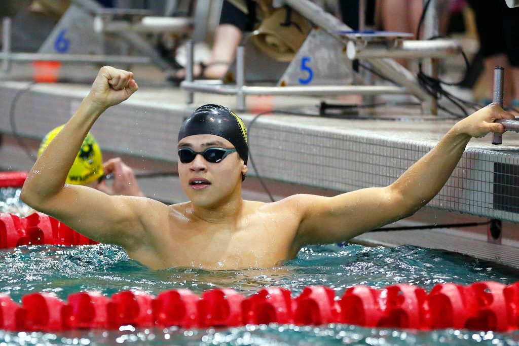 Shorecrest junior Tristan Serrano celebrates his victory in the 50-yard freestyle during the 3A District 1 championship meet Feb. 10 at the Snohomish Aquatic Center in Snohomish. (Ryan Berry / The Herald)
