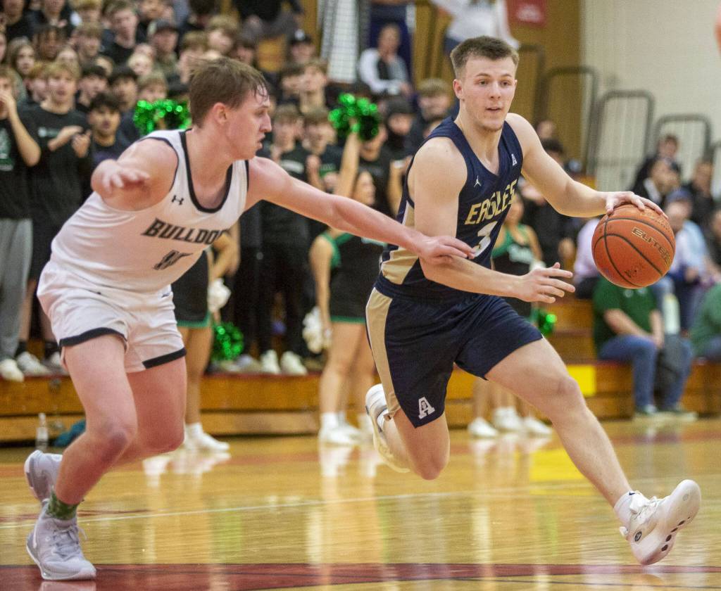 Arlingtons Jackson Trotter drives to the hoop during the game against Mount Vernon on Tuesday, Feb. 13, 2024 in Marysville, Washington. (Olivia Vanni / The Herald)