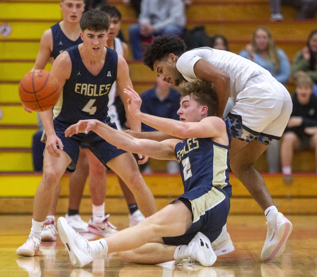 Arlingtons Leyton Martin steals the ball during the game against Mount Vernon on Tuesday in Marysville. (Olivia Vanni / The Herald)