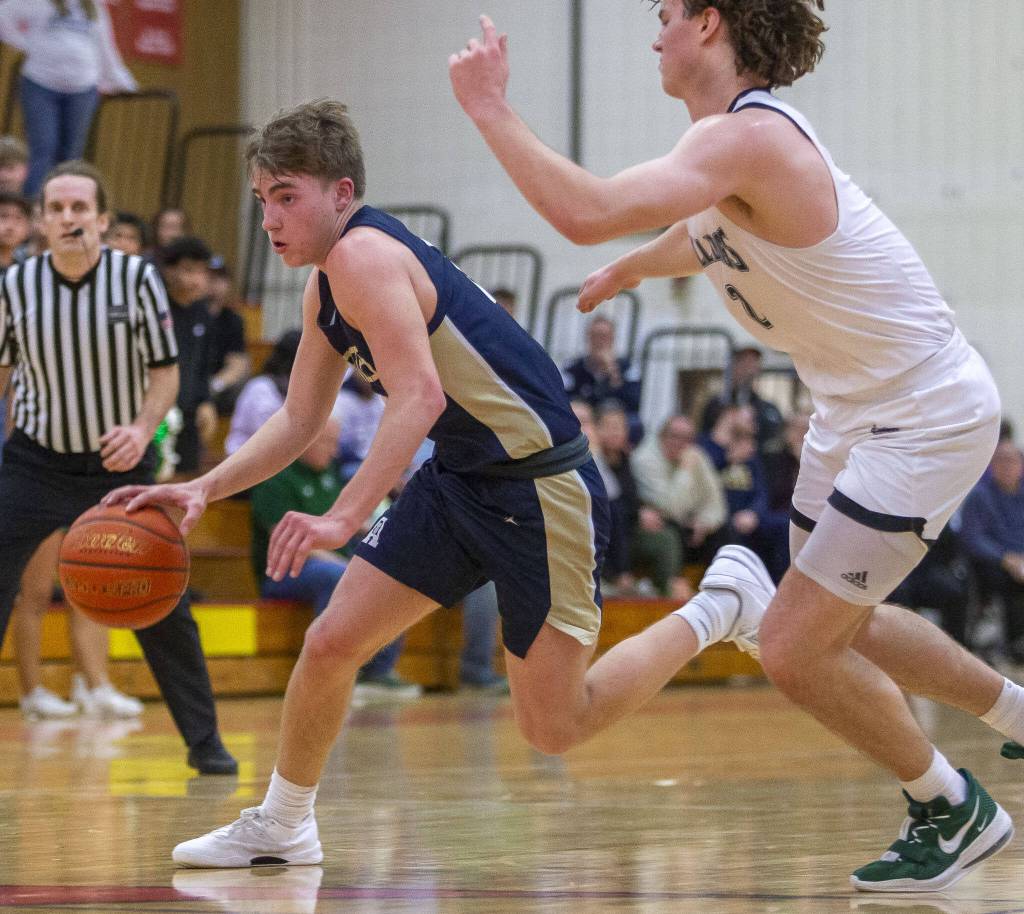 Arlingtons Leyton Martin drives to the hoop during the game against Mount Vernon on Tuesday, Feb. 13, 2024 in Marysville, Washington. (Olivia Vanni / The Herald)