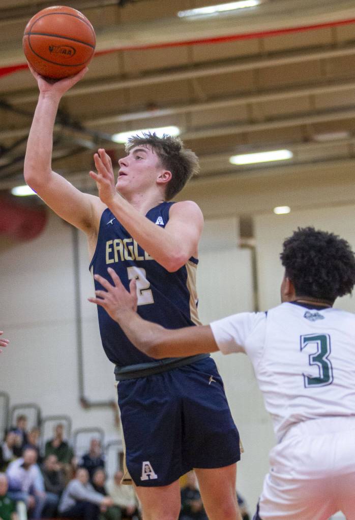 Arlingtons Leyton Martin makes a jump shot during the game against Mount Vernon on Tuesday, Feb. 13, 2024 in Marysville, Washington. (Olivia Vanni / The Herald)