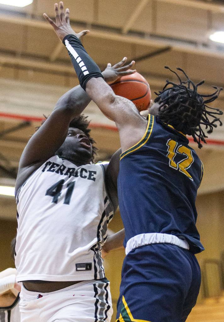 Mountlake Terraces Zaveon Jones makes a shot while being guarded during the game against Shorecrest on Tuesday, Feb. 13, 2024 in Marysville, Washington. (Olivia Vanni / The Herald)