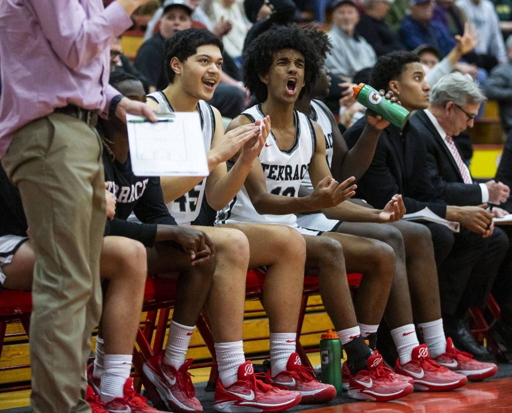 The Mountlake Terrace bench reacts to a three point shot during the game against Shorecrest on Tuesday, Feb. 13, 2024 in Marysville, Washington. (Olivia Vanni / The Herald)