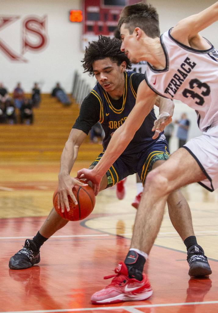 Shorecrests Robel Biniam gets the ball stolen by Mountlake Terraces Gabe Towne during the game on Tuesday, Feb. 13, 2024 in Marysville, Washington. (Olivia Vanni / The Herald)