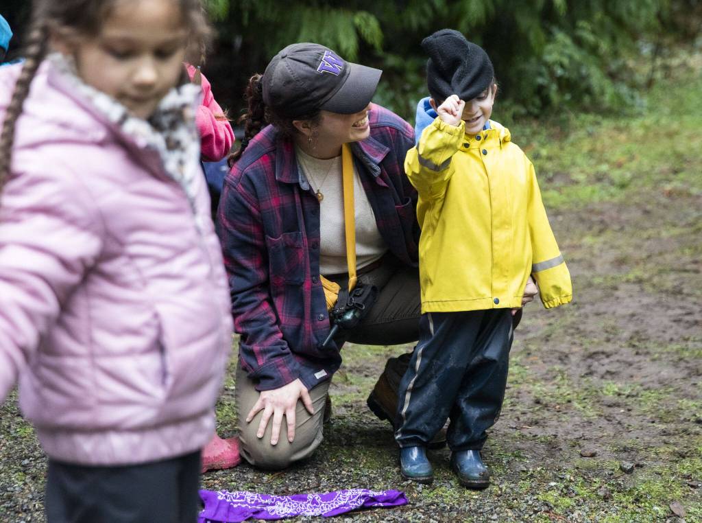 Olivia Viscioso talks with student Silas Matuson, 4, during a game on Monday, Jan. 22, 2024 in Camano Island, Washington. (Olivia Vanni / The Herald)