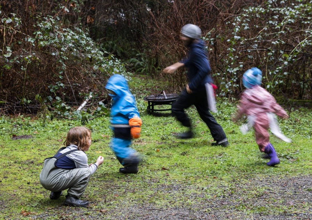 Students run around while playing a game of fox tail on Monday, Jan. 22, 2024 in Camano Island, Washington. (Olivia Vanni / The Herald)