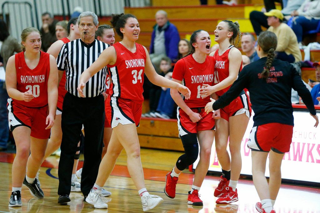Snohomish players celebrate a strong run against Meadowdale as they head for the bench during the 3A District One Semifinals on Wednesday, Feb. 14, 2024, at Marysville Pilchuck High School in Marysville, Washington. (Ryan Berry / The Herald)