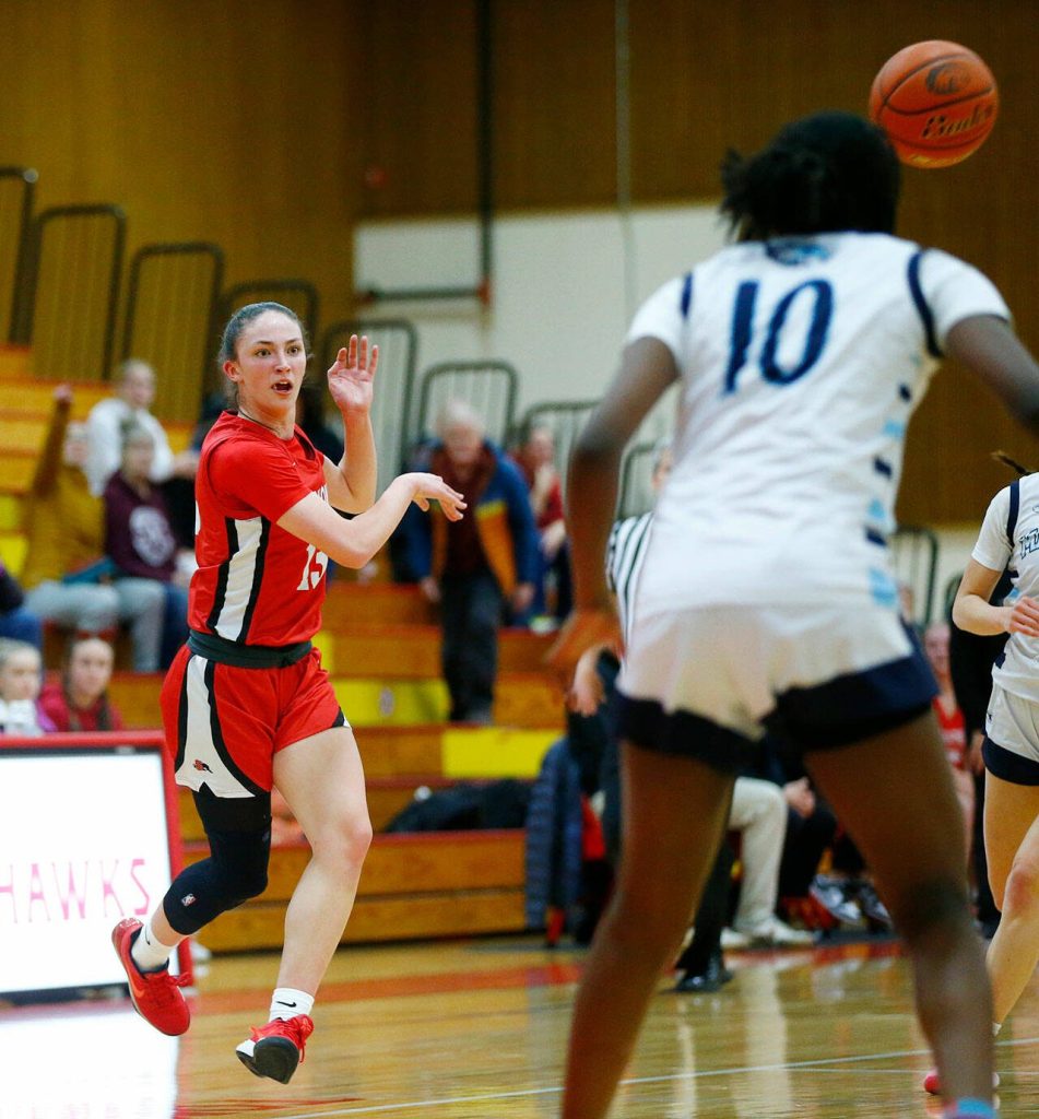 Snohomishs Sienna Capelli makes a no-look pass to a teammate against Meadowdale during the 3A District One Semifinals on Wednesday, Feb. 14, 2024, at Marysville Pilchuck High School in Marysville, Washington. (Ryan Berry / The Herald)