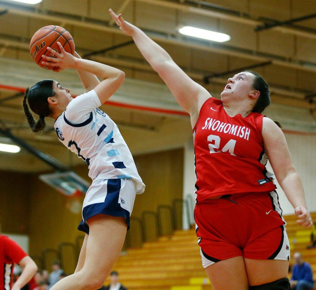 Meadowdales Gia Powell gets off a tough shot against Snohomish during the 3A District One Semifinals on Wednesday, Feb. 14, 2024, at Marysville Pilchuck High School in Marysville. (Ryan Berry / The Herald)